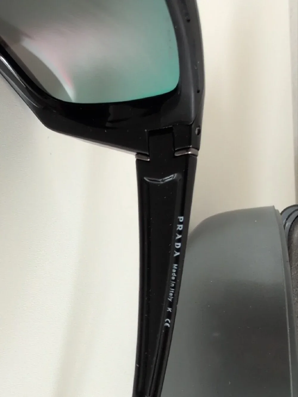 Prada Black Sunglasses with Red-Orange Mirrored Lenses
